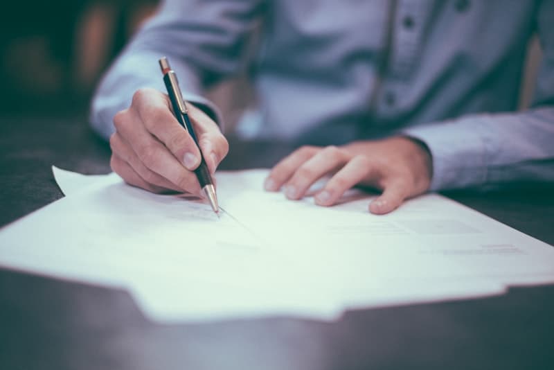 Business professional reviewing invoices and paperwork